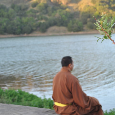 Rinpoche-sitting-in-front-water